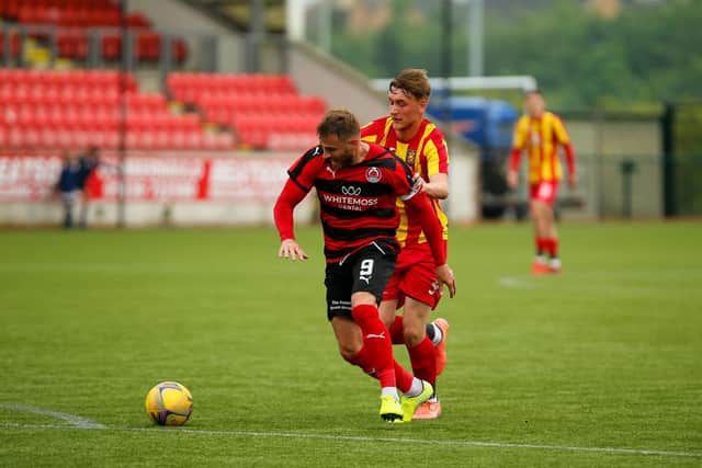 David Goodwillie holds off an Albion Rovers defender during Clyde's NL Broadwood Cup semi-final (pic: Craig Back Photography)