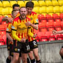 Zak Rudden celebrates scoring the opening goal in Partick Thistle's title-clinching rout of Falkirk at Firhill. (Photo by Craig Foy / SNS Group)