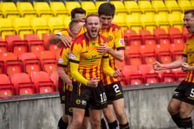 Zak Rudden celebrates scoring the opening goal in Partick Thistle's title-clinching rout of Falkirk at Firhill. (Photo by Craig Foy / SNS Group)