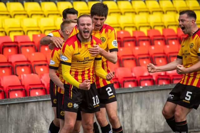 Zak Rudden celebrates scoring the opening goal in Partick Thistle's title-clinching rout of Falkirk at Firhill. (Photo by Craig Foy / SNS Group)