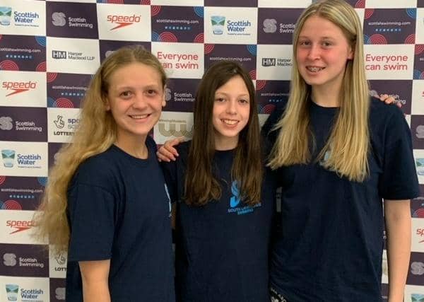 Lanark swimmers, from left, Caitlyn Hamilton, Evi Mackie and Katie Towers