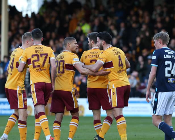 Motherwell players celebrate Efford's equaliser