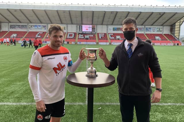 Clyde skipper David Goodwillie receives the Broadwood Cup from Matt Mitchell, Culture & Leisure North Lanarkshire team leader at Broadwood LC (pic: Craig Black Photography)