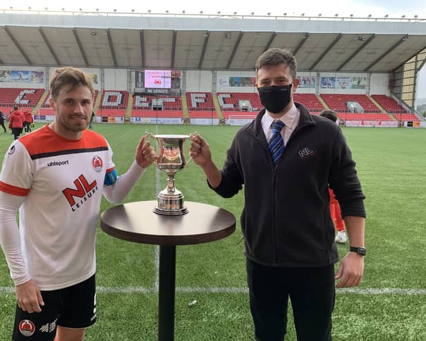 Clyde skipper David Goodwillie receives the Broadwood Cup from Matt Mitchell, Culture & Leisure North Lanarkshire team leader at Broadwood LC (pic: Craig Black Photography)