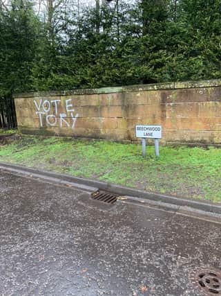 Vandals have defaced the private wall in a Bearsden residential estate in the run-up to the Scottish Parliament elections