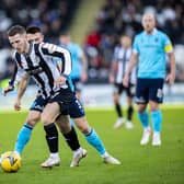 St Mirren's Kyle McAllister is harried by Dundee FC's Jordan Marshall. (Photo by Roddy Scott / SNS Group)