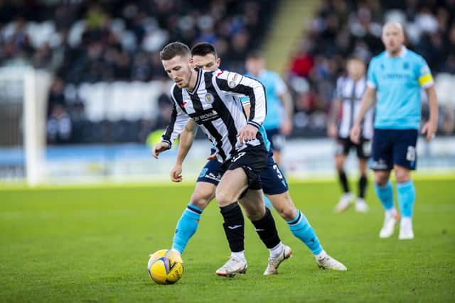 St Mirren's Kyle McAllister is harried by Dundee FC's Jordan Marshall. (Photo by Roddy Scott / SNS Group)