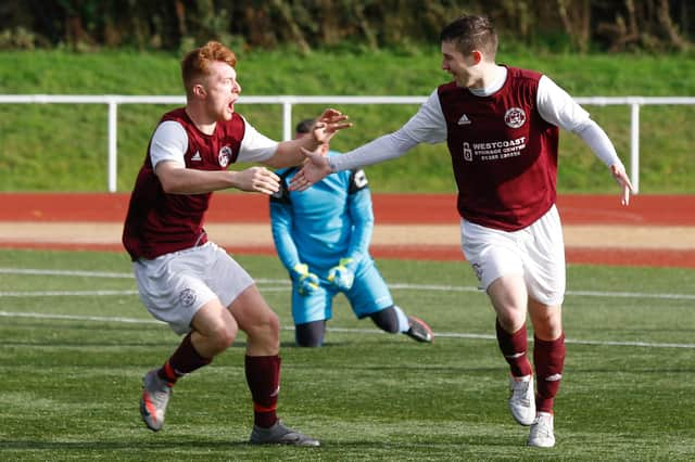 Carluke's Mark O'Reilly (left) celebrates with scorer James Frame after Frame's late goal against Port Glasgow Juniors made it 2-2 (Pic by Kevin Ramage)