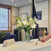 Provost Margaret Cooper was among the first to leave a message in the Book of Condolence in Hamilton.