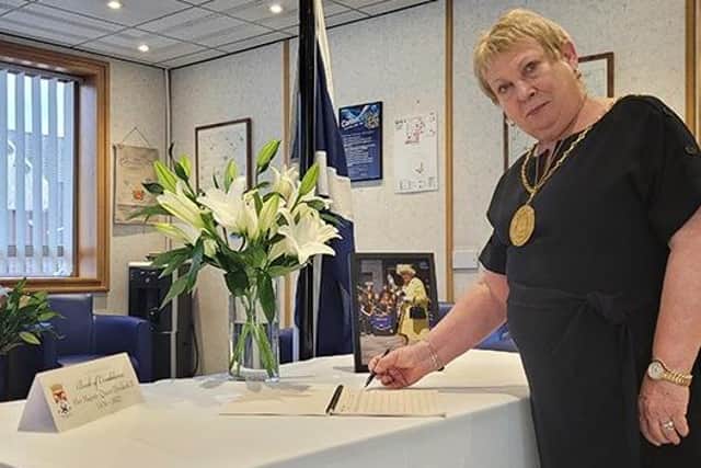 Provost Margaret Cooper was among the first to leave a message in the Book of Condolence in Hamilton.