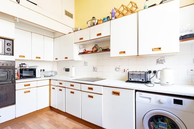 One of the kitchens is adjoined to one of the bedrooms.