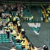Fans clash at full-time after the 1-1 draw between Celtic and Rangers at Celtic Park. (Photo by Alan Harvey / SNS Group)