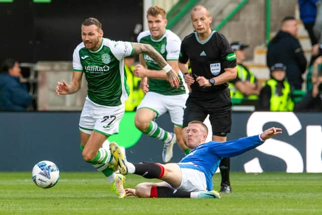 Rangers' John Lundstram was shown a straight red card for this tackle on Hibs' Martin Boyle by referee Willie Collum.