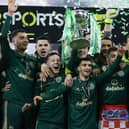 Celtic captain Callum McGregor lifts the Premier Sports Cup after Kyogo Furuhashi scored twice in a 2-1 win over Hibs at Hampden. (Photo by Craig Williamson / SNS Group)