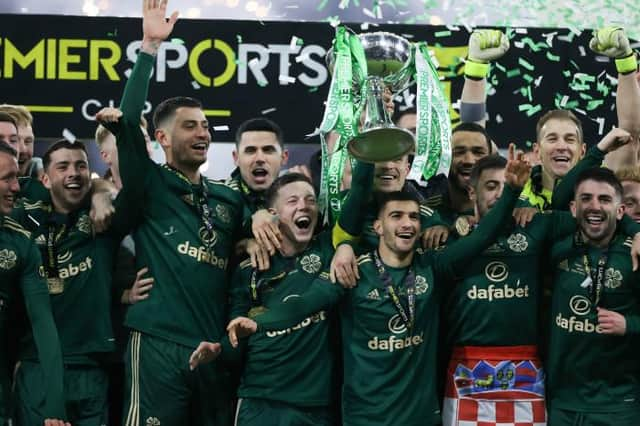 Celtic captain Callum McGregor lifts the Premier Sports Cup after Kyogo Furuhashi scored twice in a 2-1 win over Hibs at Hampden. (Photo by Craig Williamson / SNS Group)