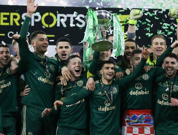 Celtic captain Callum McGregor lifts the Premier Sports Cup after Kyogo Furuhashi scored twice in a 2-1 win over Hibs at Hampden. (Photo by Craig Williamson / SNS Group)