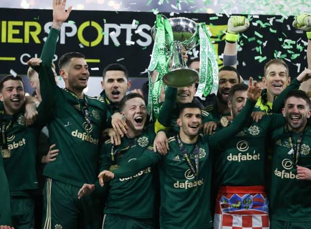 Celtic captain Callum McGregor lifts the Premier Sports Cup after Kyogo Furuhashi scored twice in a 2-1 win over Hibs at Hampden. (Photo by Craig Williamson / SNS Group)