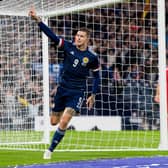 Lyndon Dykes celebrates making it 1-0. Picture: SNS