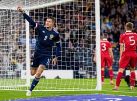 Lyndon Dykes celebrates making it 1-0. Picture: SNS
