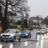 Temporary traffic lights put up for the start of the work on the A81 demonstrate the extent of the problem as cars back all the way towards Milngavie police station