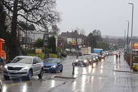Temporary traffic lights put up for the start of the work on the A81 demonstrate the extent of the problem as cars back all the way towards Milngavie police station