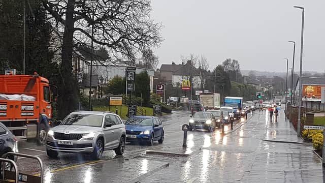 Temporary traffic lights put up for the start of the work on the A81 demonstrate the extent of the problem as cars back all the way towards Milngavie police station