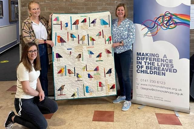 Aileen McKay, from the Busby Quilters and the Glasgow Gathering of Quilters, met Richmond’s Hope staff to hand over the quilts