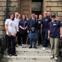Fisher German's Glasgow team and representatives from Simon Community Scotland gather before setting off on their journey.