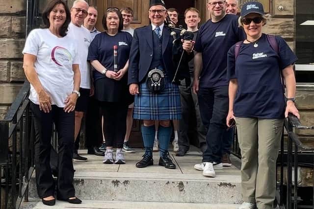 Fisher German's Glasgow team and representatives from Simon Community Scotland gather before setting off on their journey.