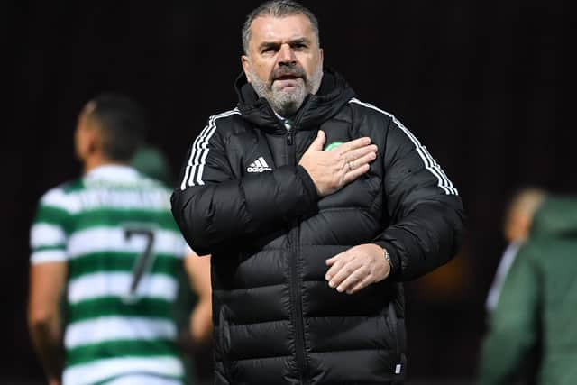 Celtic manager Ange Postecoglou celebrates with the travelling fans after the 2-1 win over Motherwell at Fir Park. (Photo by Ross MacDonald / SNS Group)