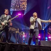 Simple Minds’ founding members Jim Kerr, lead singer, and Charlie Burchill, guitar, playing live at the First Direct Arena, Leeds. Picture Ernesto Rogata
