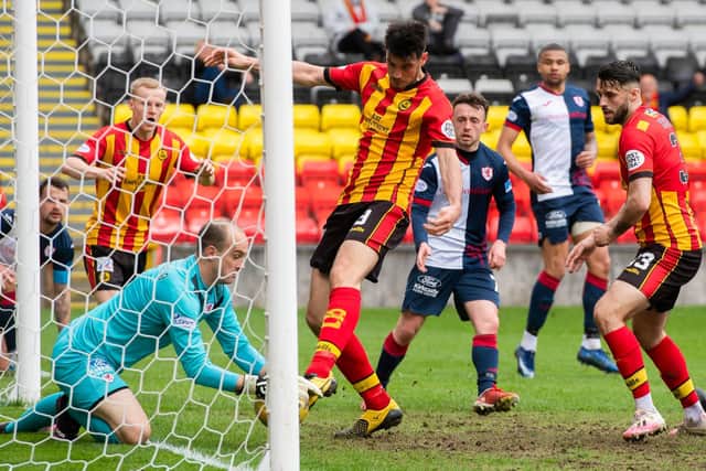 Jamie MacDonald blocks on the goal line from ex-Rover Brian Graham in the match at Firhill between Partick Thistle and Raith Rovers (picture by Sammy Turner / SNS Group).