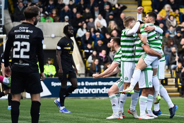 Celtic players celebrate Daizen Maeda's opening goal in the 3-1 win at Livingston (Photo by Paul Devlin / SNS Group)