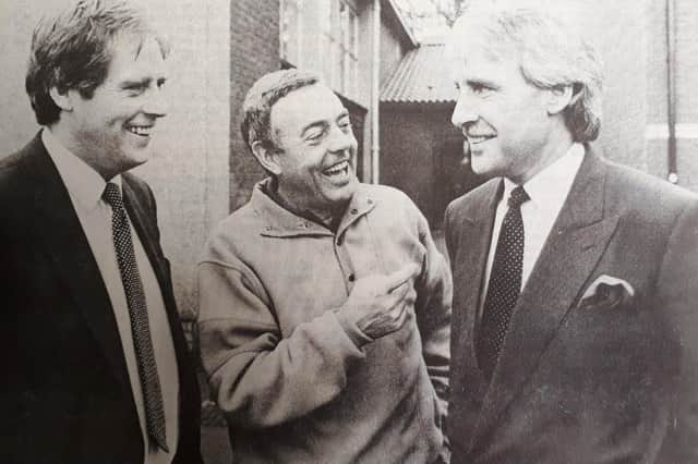 Ian St John is pictured (centre) during a visit to Scotland in 1988, during which he launched a youth football coaching initiative