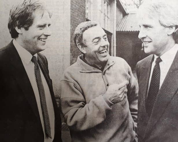 Ian St John is pictured (centre) during a visit to Scotland in 1988, during which he launched a youth football coaching initiative
