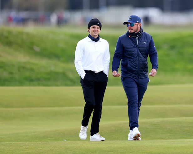 Ewen Ferguson shares a joke with pro-am partner Brad Simpson, lead singer of The Vamps, at The Alfred Dunhill Links Championship. (Photo by Richard Heathcote/Getty Images)