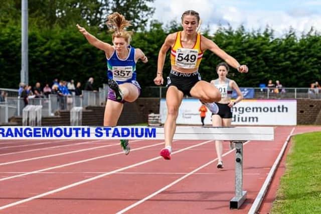 Emily McNicol in steeplechase action