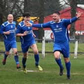 Neil Schoneville celebrating scoring for Lesmahagow Juniors