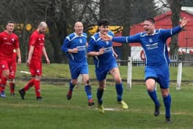 Neil Schoneville celebrating scoring for Lesmahagow Juniors