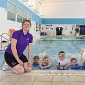 Swimming teachers Keira Higgins and Cara Murray with some of their pupils.


‘