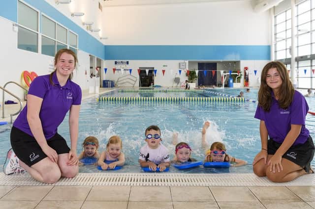 Swimming teachers Keira Higgins and Cara Murray with some of their pupils.


‘