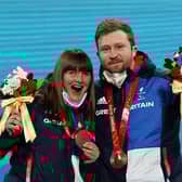 BEIJING, CHINA - MARCH 05: Bronze Medallists Millie Knight and their guide Brett Wild celebrate with their medals during the Para Alpine Skiing Women's Downhill Vision Impaired Medal Ceremony during Day One of the Beijing 2022 Winter Paralympics at Yanqing Para Medals Plaza on March 05, 2022 in Yanqing, China. (Photo by Alexander Hassenstein/Getty Images)