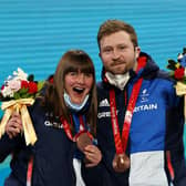 BEIJING, CHINA - MARCH 05: Bronze Medallists Millie Knight and their guide Brett Wild celebrate with their medals during the Para Alpine Skiing Women's Downhill Vision Impaired Medal Ceremony during Day One of the Beijing 2022 Winter Paralympics at Yanqing Para Medals Plaza on March 05, 2022 in Yanqing, China. (Photo by Alexander Hassenstein/Getty Images)