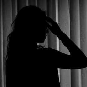 PICTURE POSED BY MODEL. A woman showing signs of depression.