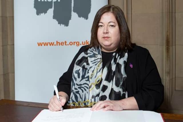 Kirsten Oswald signs the Holocaust Educational Trust's Book of Commitment at Westminster