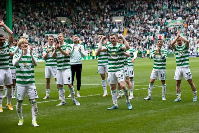 Celtic's players salute their support after effectively ensuring the title with their 4-1 slaying of Hearts. (Photo by Alan Harvey / SNS Group)