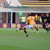 Devante Cole slots in his penalty against Livingston