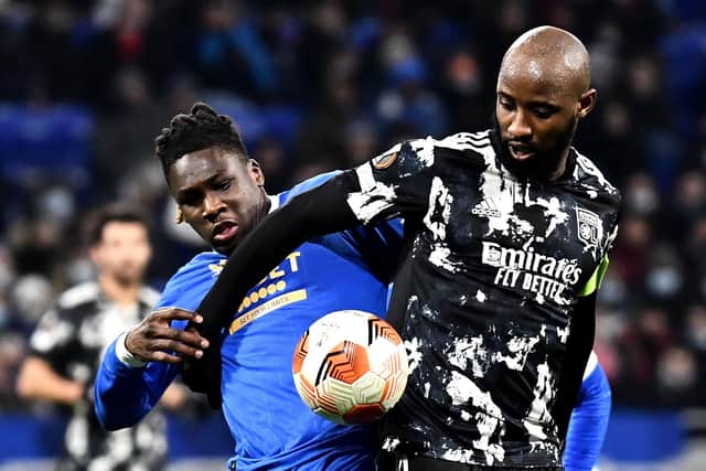 Rangers defender Calvin Bassey (left) tussles with former Celtic striker Moussa Dembele during Thursday's Europa League match in Lyon. (Photo by JEFF PACHOUD/AFP via Getty Images)