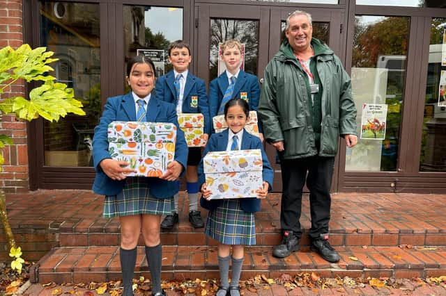 Junior School pupils from The High School of Glasgow prepare to hand over Harvest Week donations to three local charities.