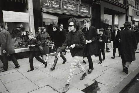 Photographer Barry Feinstein captured Bob Dylan walking along Princes Street in May 1966.